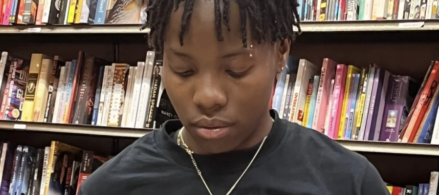Student behind the library