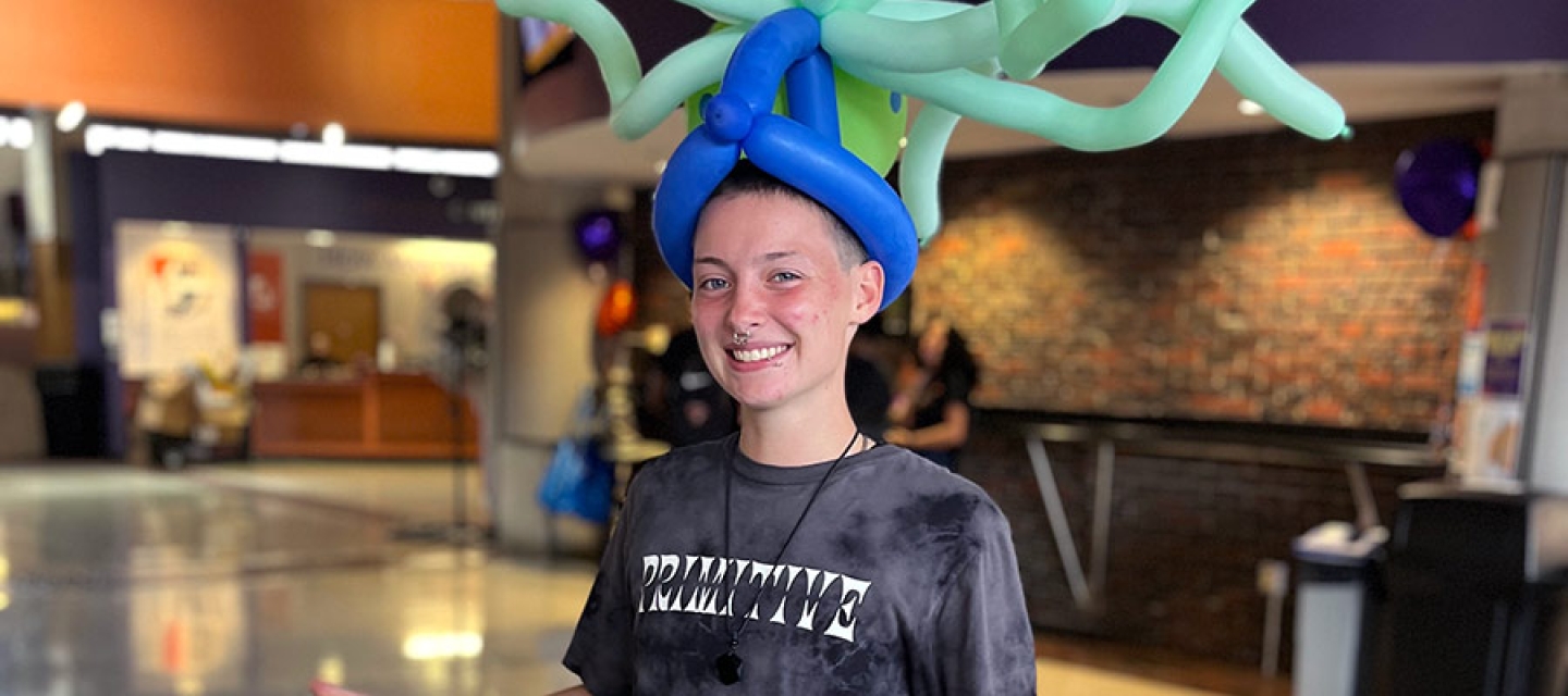 Student wearing a balloon hat.